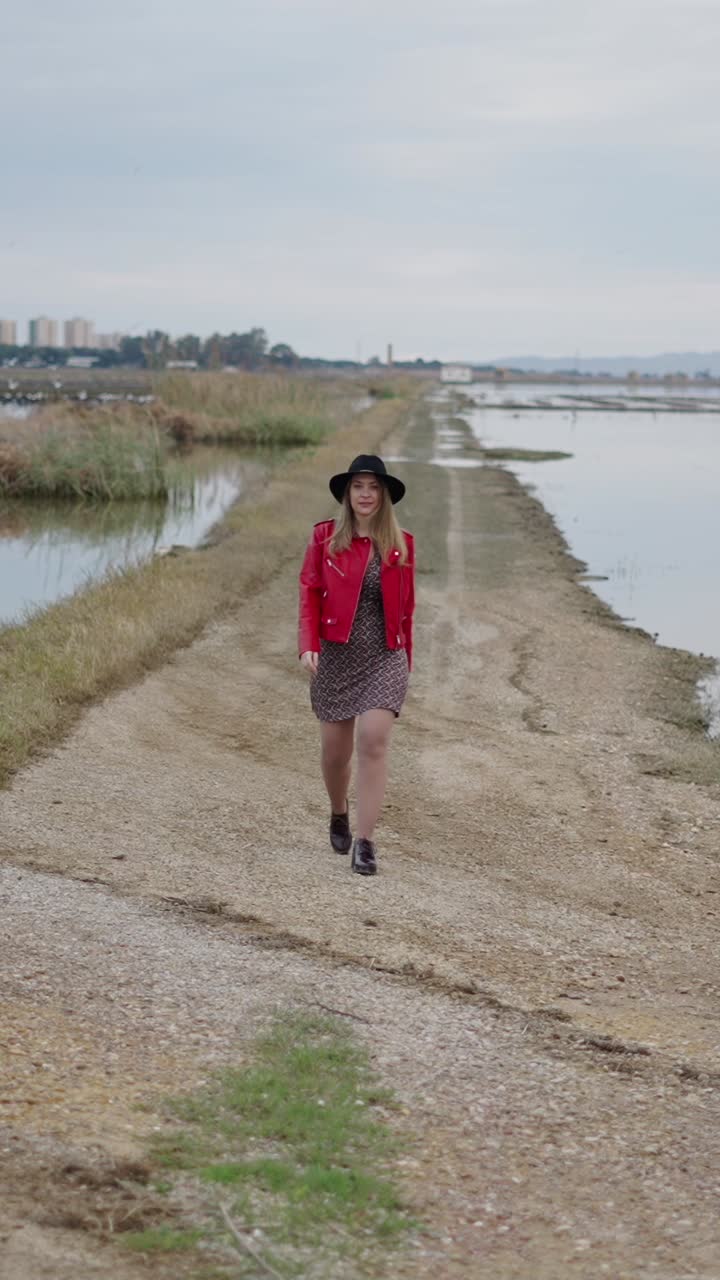 Woman walking on a path in the countryside