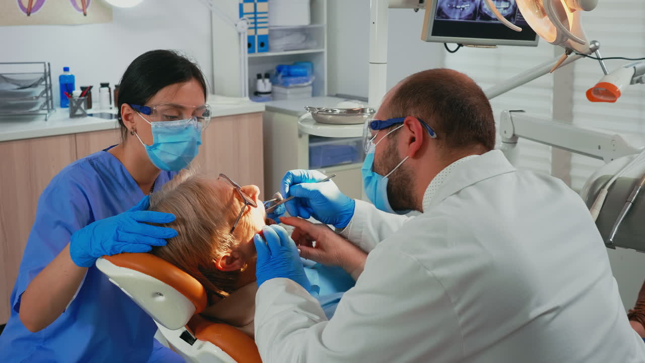 Doctor and nurse preparing patient for removing crowns