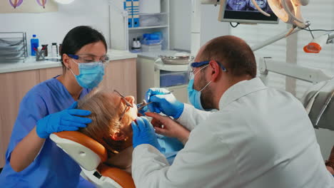 doctor and nurse preparing patient for removing crowns