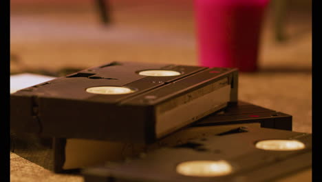 Close-up-view-of-VHS-cassettes-on-the-floor