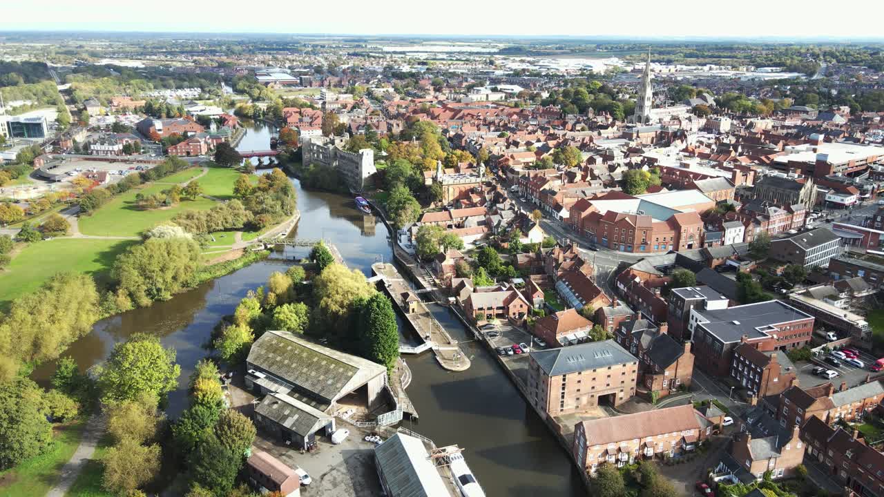 Newark on Trent aerial footage of river lock and town high point of view