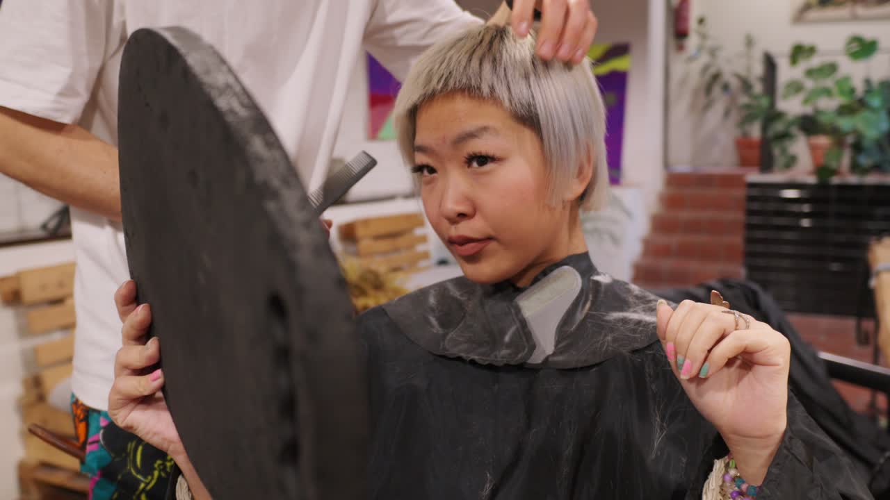 Woman getting a haircut at a hair salon
