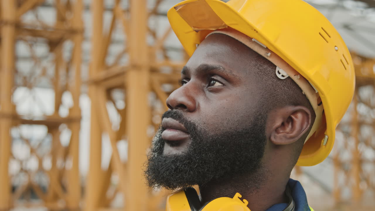 Black Male Worker Putting On Safety Goggles