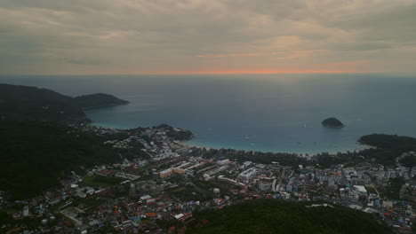 aerial view of a tropical coastal town at sunset