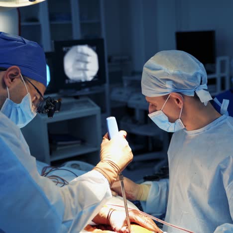 team surgeon at work in operating room. modern equipment in operating room. medical devices for neurosurgery