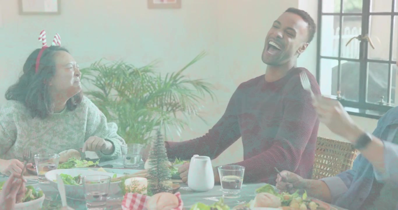 Maroon sweater man speaking causing floating chat and confetti icons as group toasting for dining