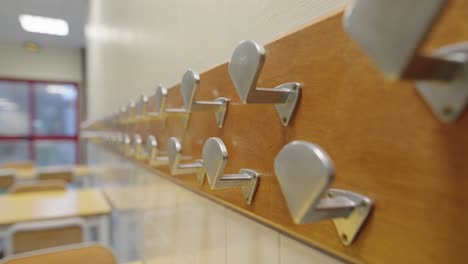 hangers anchored to the wall of a children's school
