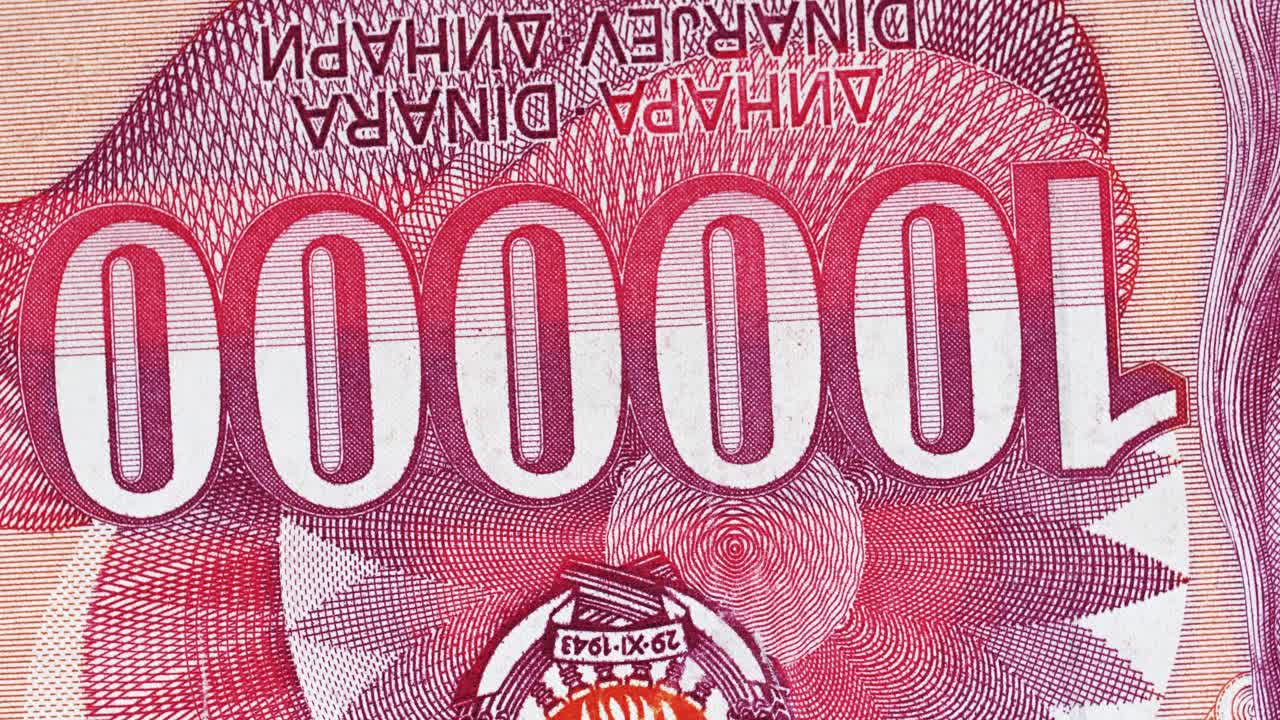 Yugoslavia hundred thousand dinar banknote obverse with large numeral detail rotating on black background