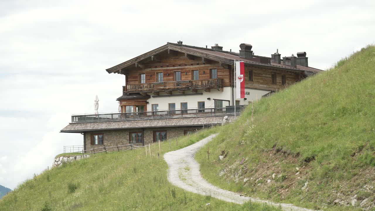 Traditional alpine house on hillside in Kitzbühel, Austria.
