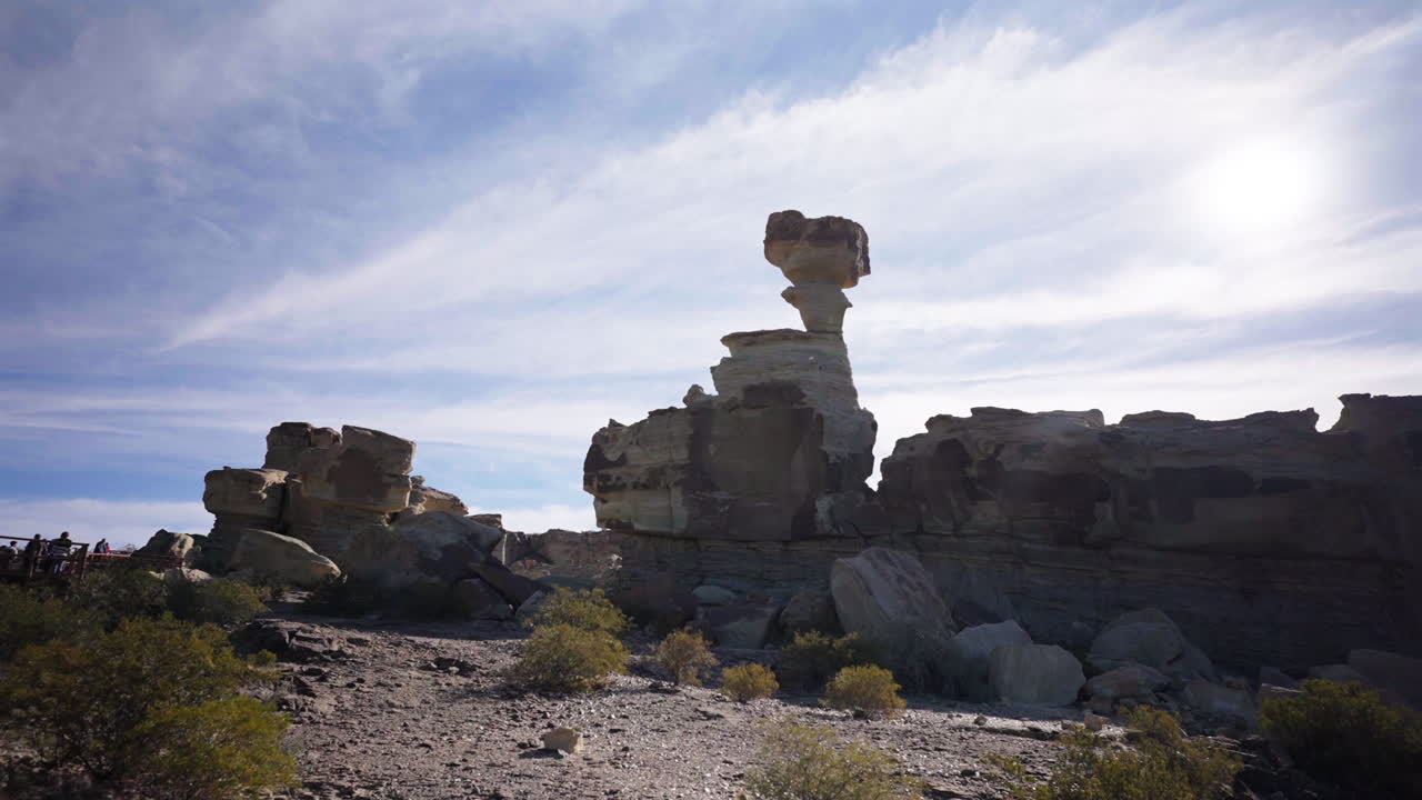A beautiful, backlit shot of "The Mushroom" (El Hongo), the most famous and iconic rock formation in Argentina's Valley of the Moon (Valle de la Luna), Ischigualasto Park
