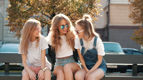 three happy friends enjoying time together outdoors.