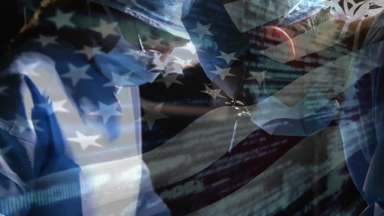 animación de la bandera de los estados unidos de américa ondeando sobre los cirujanos en el quirófano