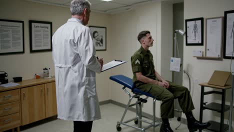 doctor examining a military personnel