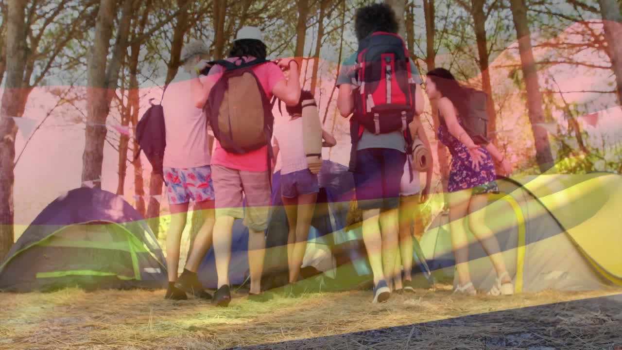 grupo de amigos acampando con animación de la bandera de alemania sobre el fondo del bosque
