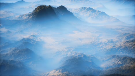 distant mountain range and thin layer of fog on the valleys