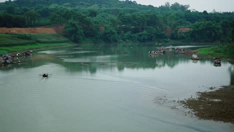 river scene with floating houses and lush greenery