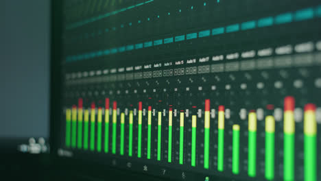 digital audio levels sound mixing faders in a recording studio