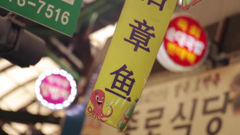 blinking signs in busy street market in seoul south korea