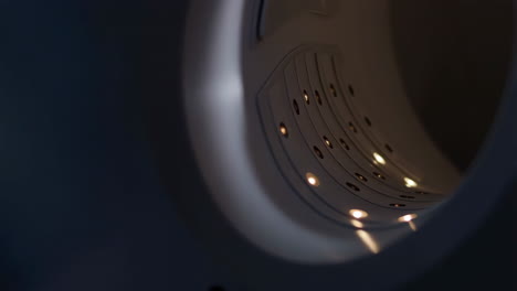 inside a washing machine drum with lights