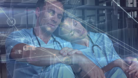 Animation-of-network-of-connections-over-caucasian-female-and-male-doctors-napping