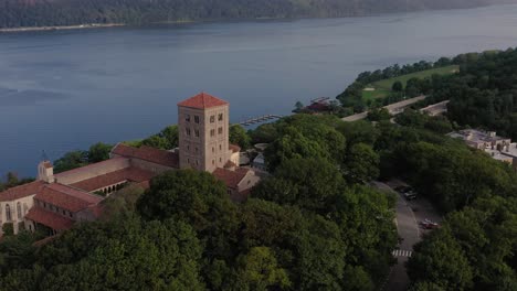 clockwise orbit of the cloisters museum in upper manhattan nyc on the bank of the hudson river settling tilt up reveals the beautiful palisades and hudson valley in the distance