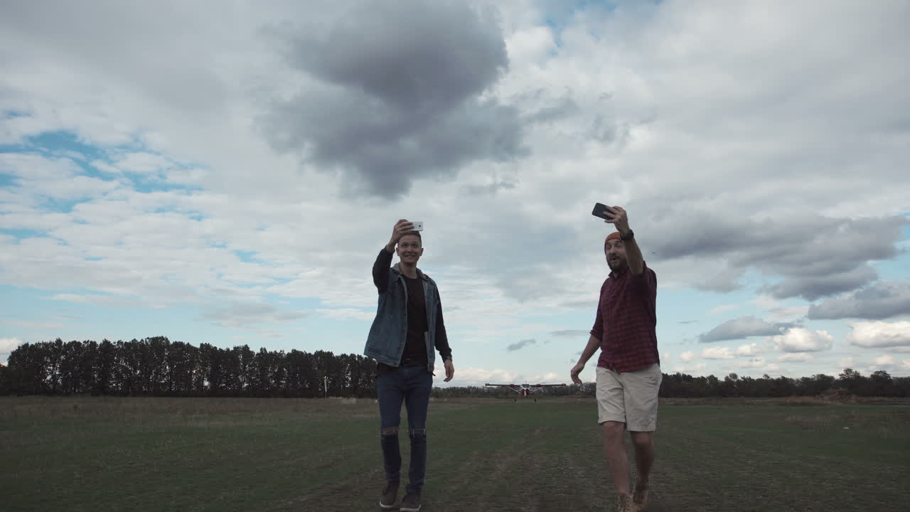 Friends Taking Selfie and Drone near Airport