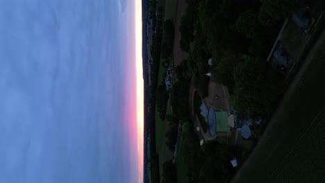 aerial late evening view of glamping park at north limburg during setting sun on horizon