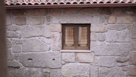 wood frame window in an old stone house slide reveal