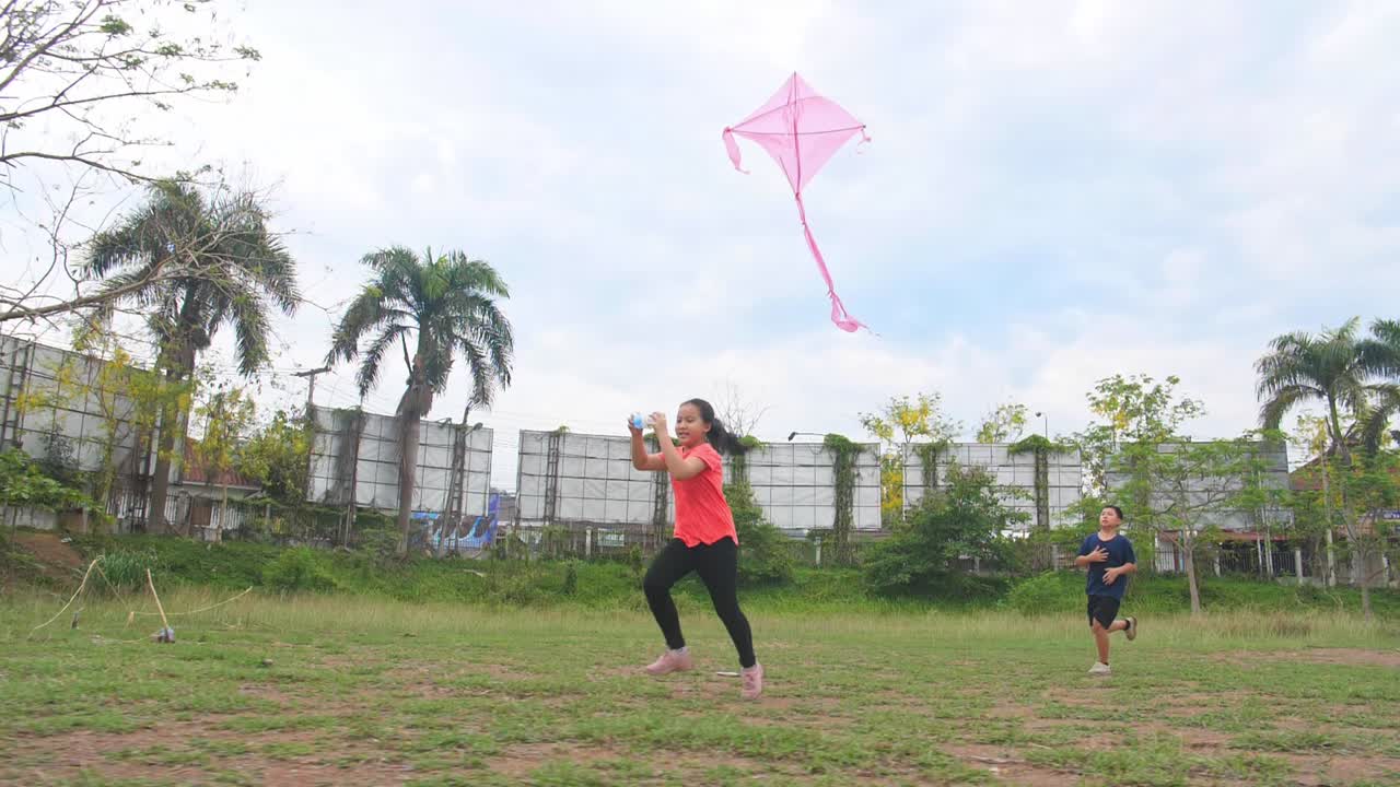 Children Flying a Kite in a Park
