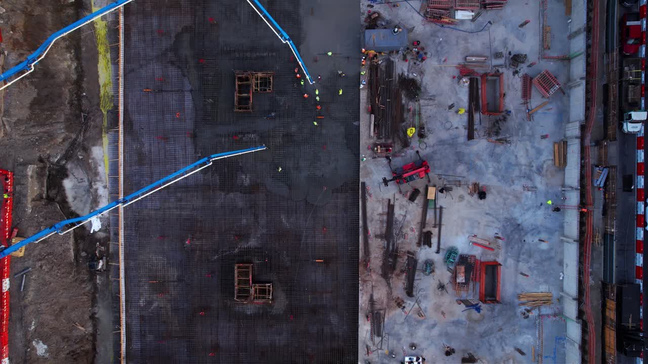 Aerial view above a urban construction site in middle of buildings in Brooklyn, NY - cenital, drone shot