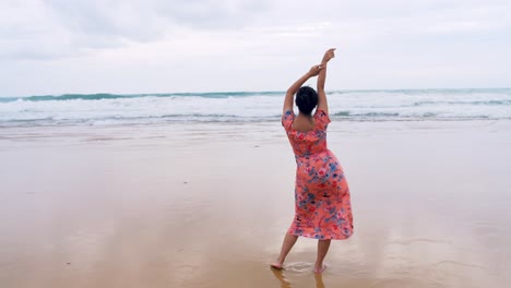 Young-Asian-woman-admiring-the-beauty-of-the-ocean,-Patong-Beach-in-Phuket