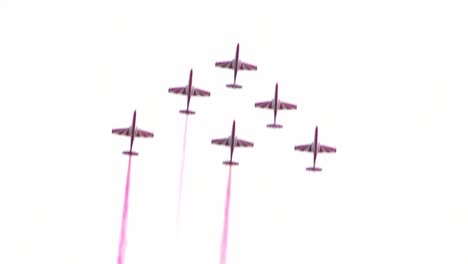 six airplanes fly in formation on a cloudy day in berlin