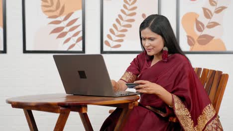 indian woman using debit card