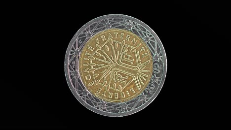 france 2002 2 euro obverse with tree of life and motto rotating on black background