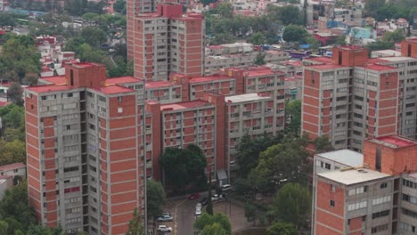 overhead drone footage of copilco's reddish residential buildings