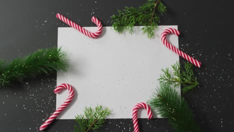 video of christmas decorations with white card and copy space on black background