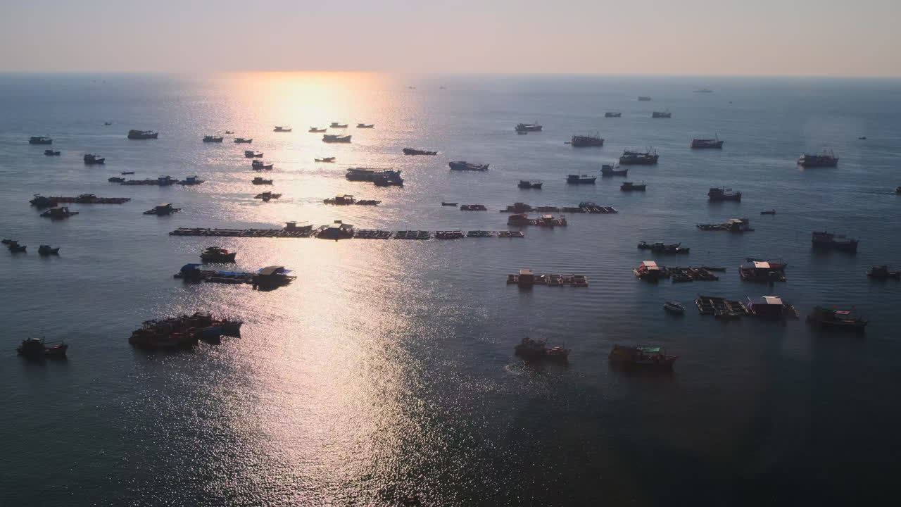 Many Fishing Boats on the Ocean at Sunset