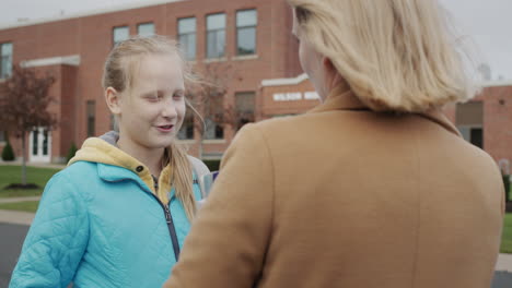 student talks to teacher outside school