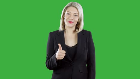 attractive blonde haired woman wearing a business suit his a thumbs up