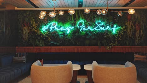 hotel lobby lounge room with glowing neon sign