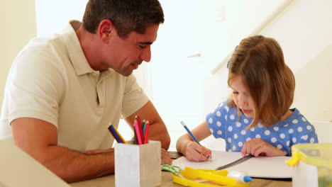 father and daughter drawing together