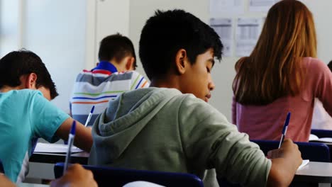 students doing homework in classroom