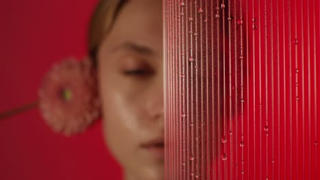 woman with flower and water drops