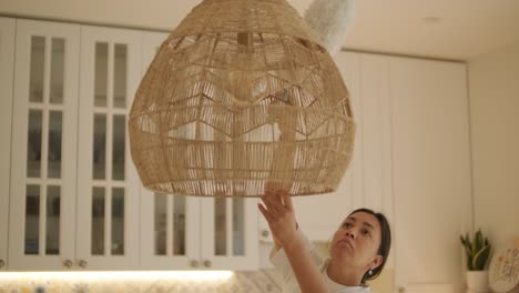 a beautiful pregnant woman tidying her home, engaged in household chores. the scene captures domestic life, maternity, and the balance of routine and preparation during pregnancy