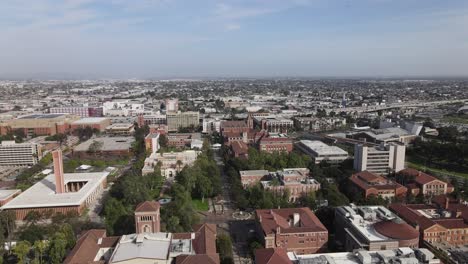 Rising-aerial,-USC-campus-school-buildings,-cloudy-afternoon