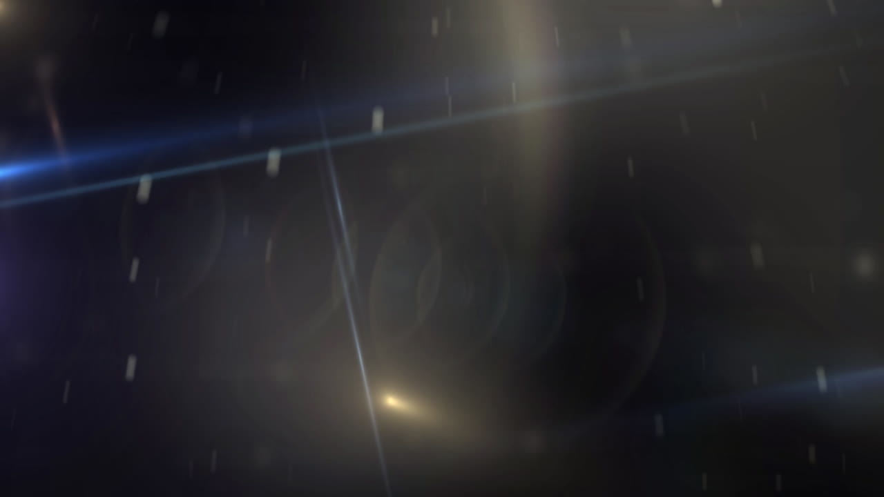 Bagliori di luce ottici astratti e particelle fluttuanti