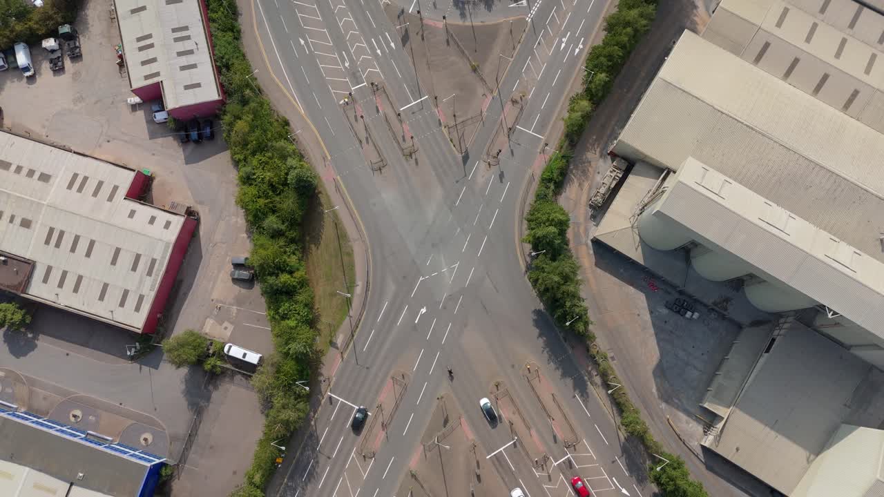 Aerial drone top down view of busy motorway junction intersection with cars and trucks driving through Rugby England UK