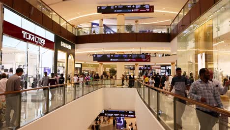 shoppers walking in a bustling dubai mall