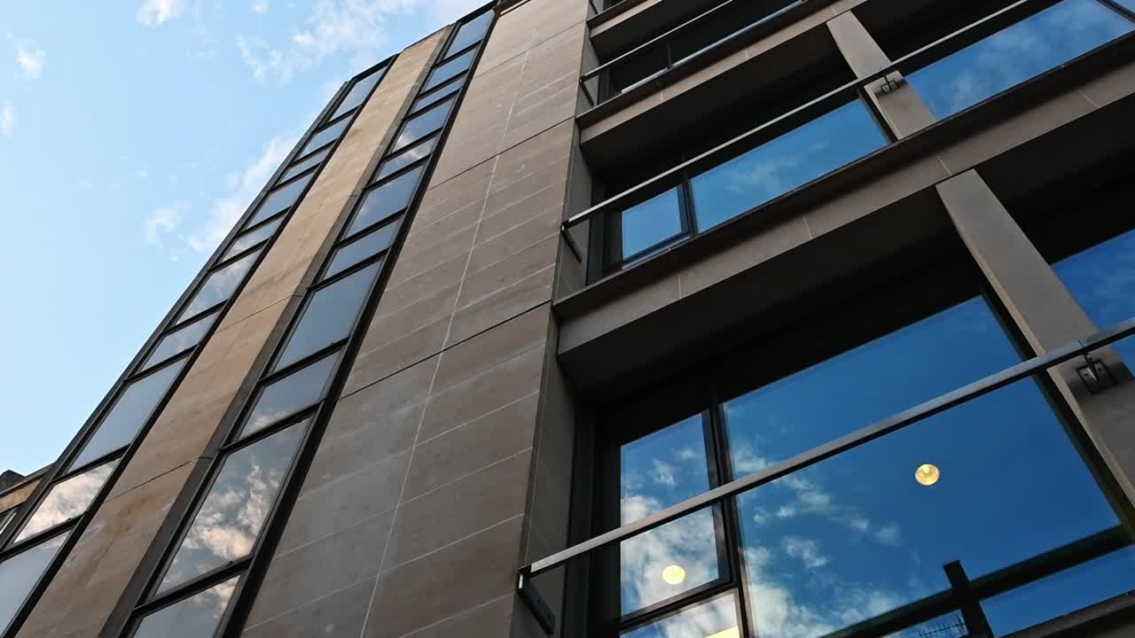 A time-lapse of clouds rolling by a London building