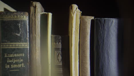 close up shot of some old books on the shelve